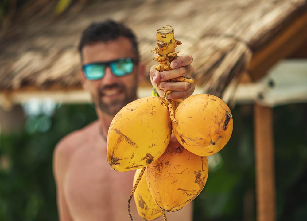 Man holding coconut