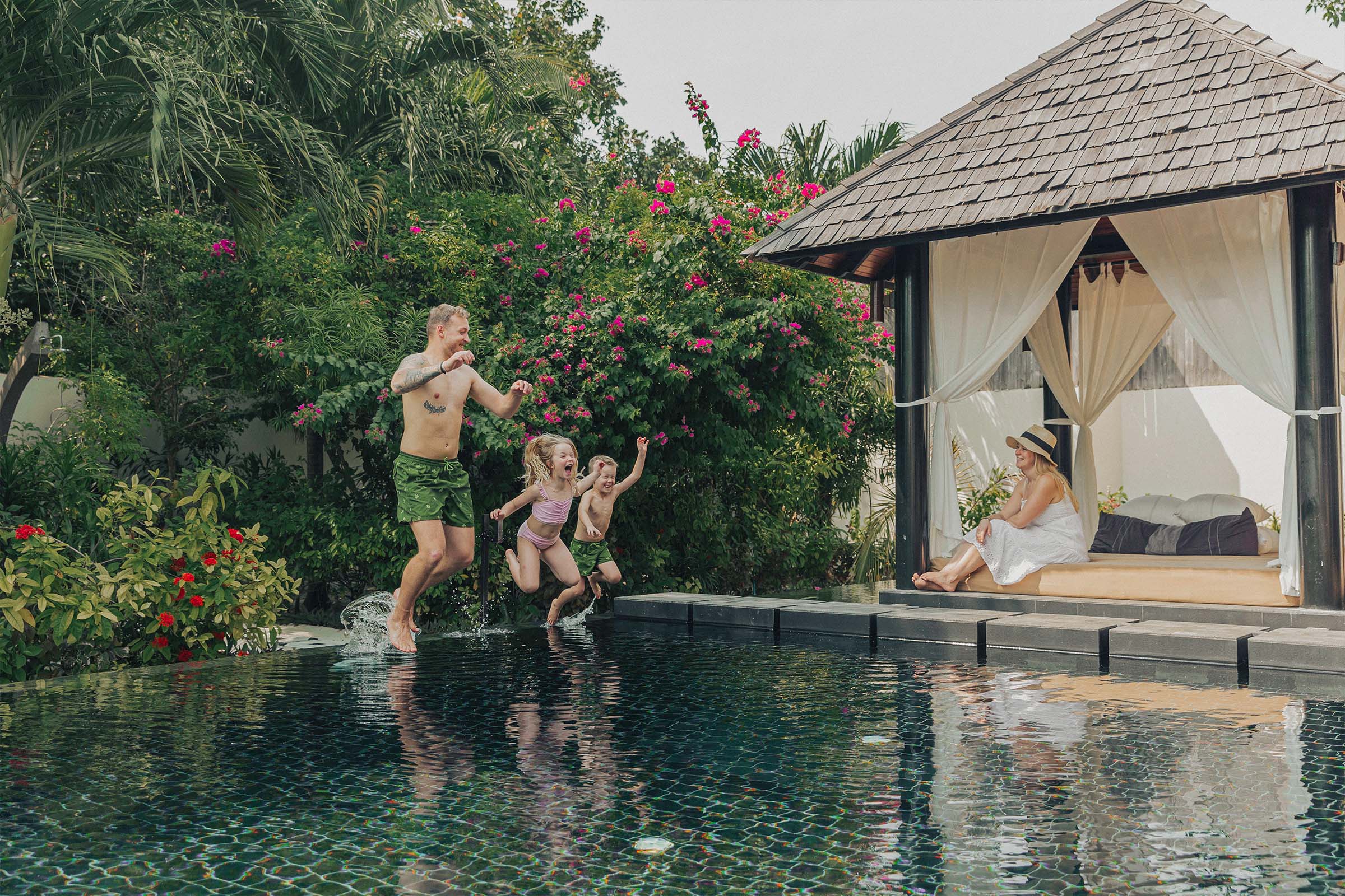 Sun Siyam Iru Fushi Easter Family Lifestyle Images - jumping into the pool