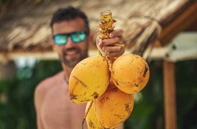 Man holding coconut